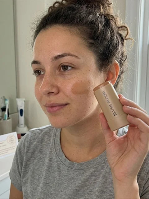 Camila using the balm